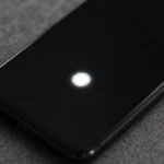 Phone screen showing a bright white spot on the display